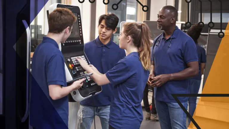 Group of apprentices using machinery in a factory setting, being overseen by a teacher. Make UK branded