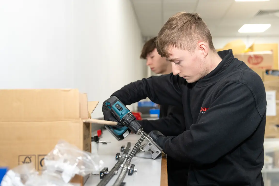 T Level students bolting chain link 