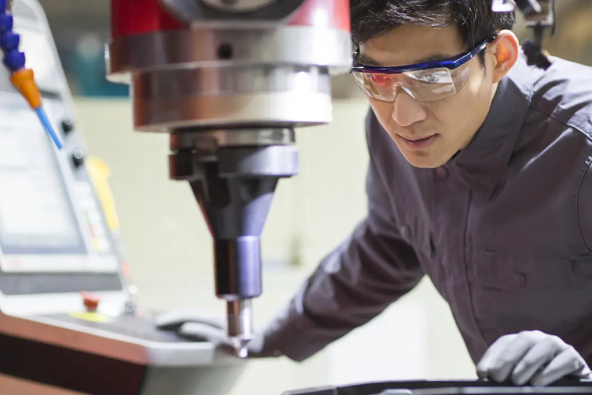 young engineer working in the factory