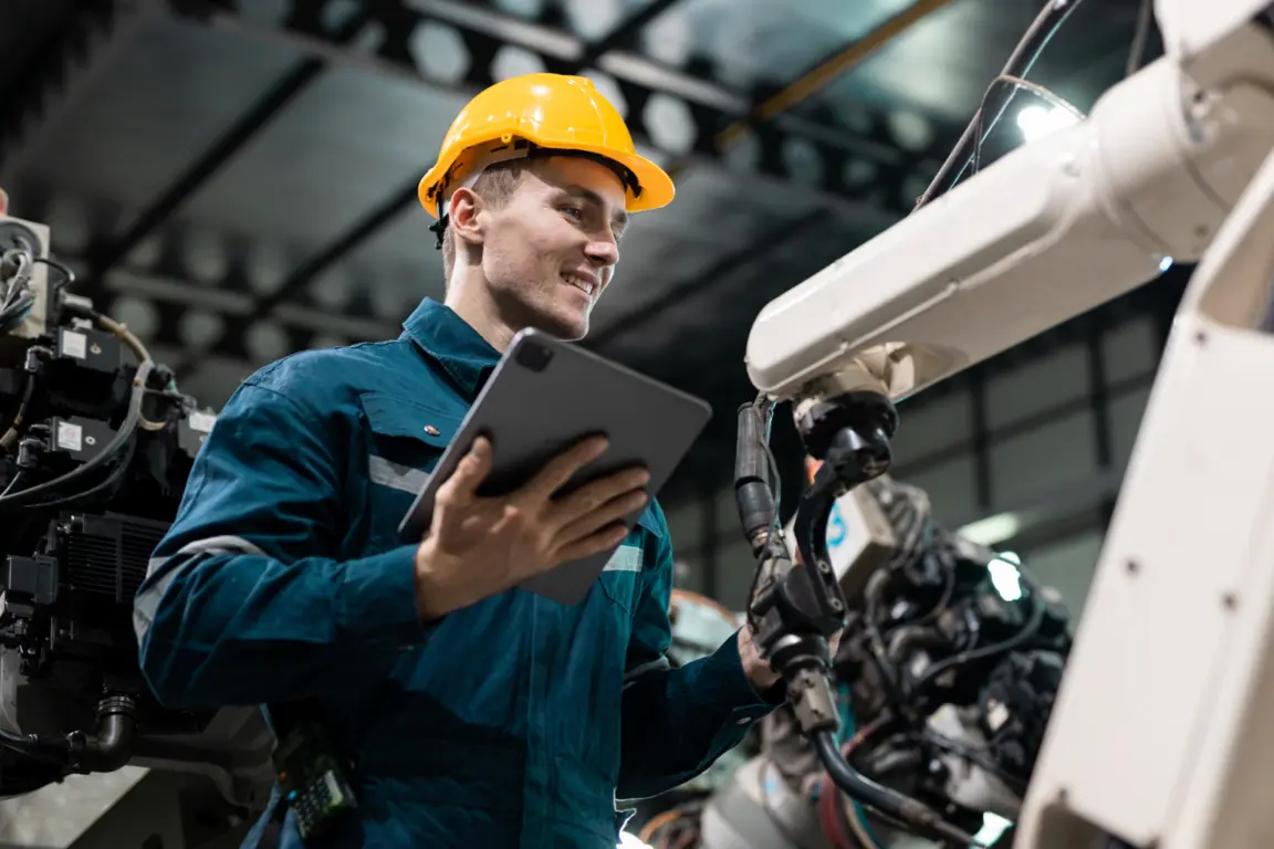 Worker using tablet in factory
