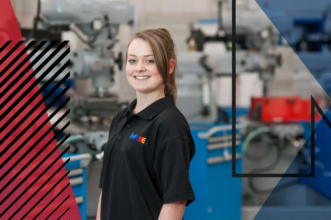 Image of woman wearing Make UK polo top in a factory setting. Make UK branded
