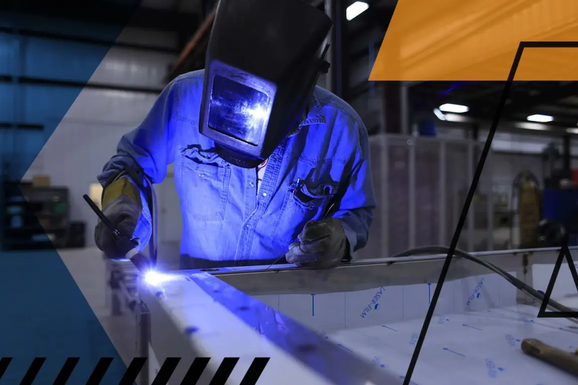 Branded photo of man welding metal with protective helmet on