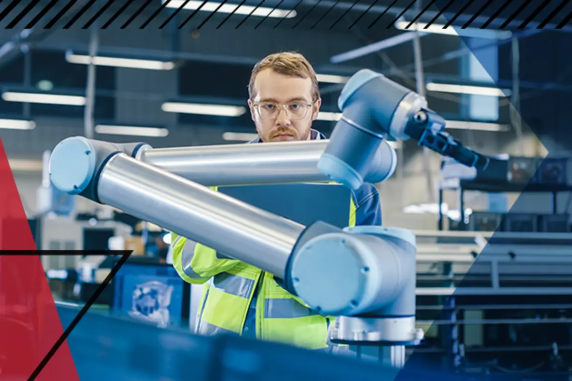 Man looking at robotic arm used in assembly line in a factory setting. Make UK branded