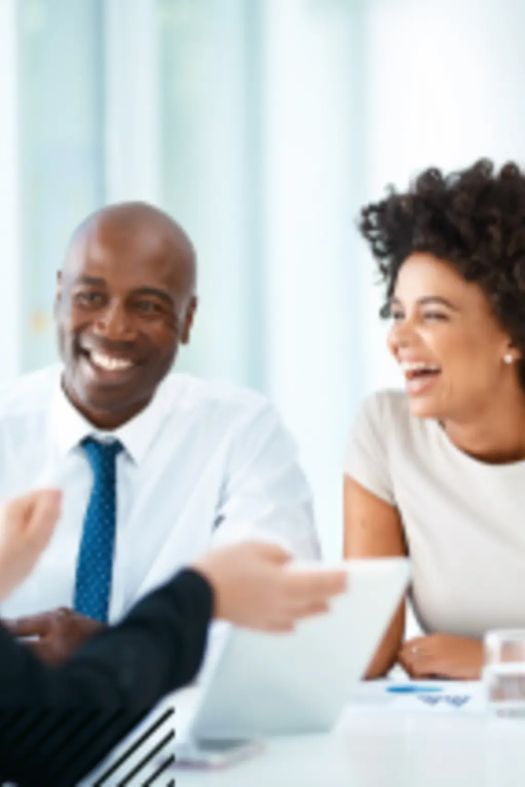 People happily speaking to their consultant