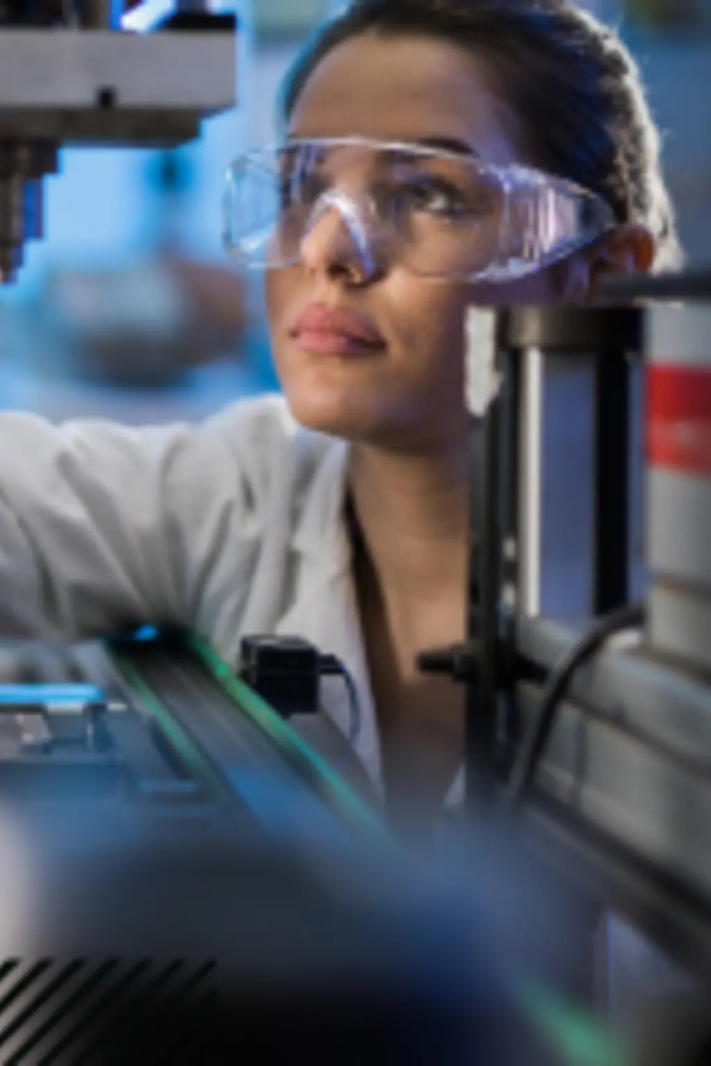 Woman studying machinery